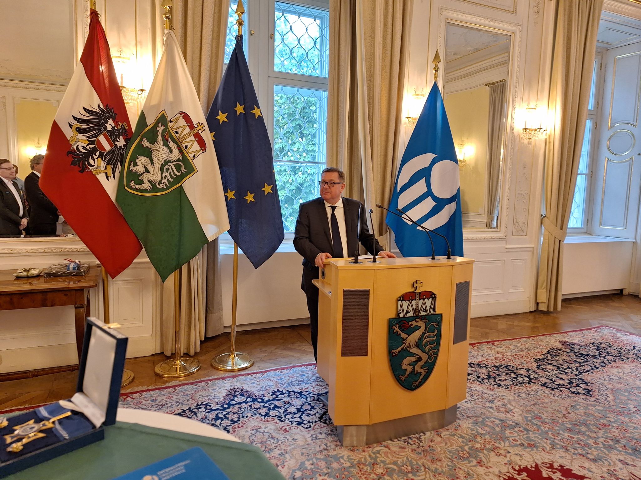 Former IOI Secretary General, Minister Werner Amon, addressing guests upon receiving the Golden Order of Merit.